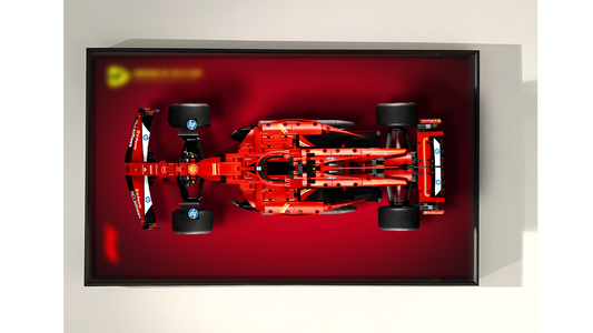 LEGO Technic Ferrari SF-24 42207 model displayed in a custom Wall Frame, with LED lighting simulating a racetrack effect, highlighting its mechanical details and red livery.